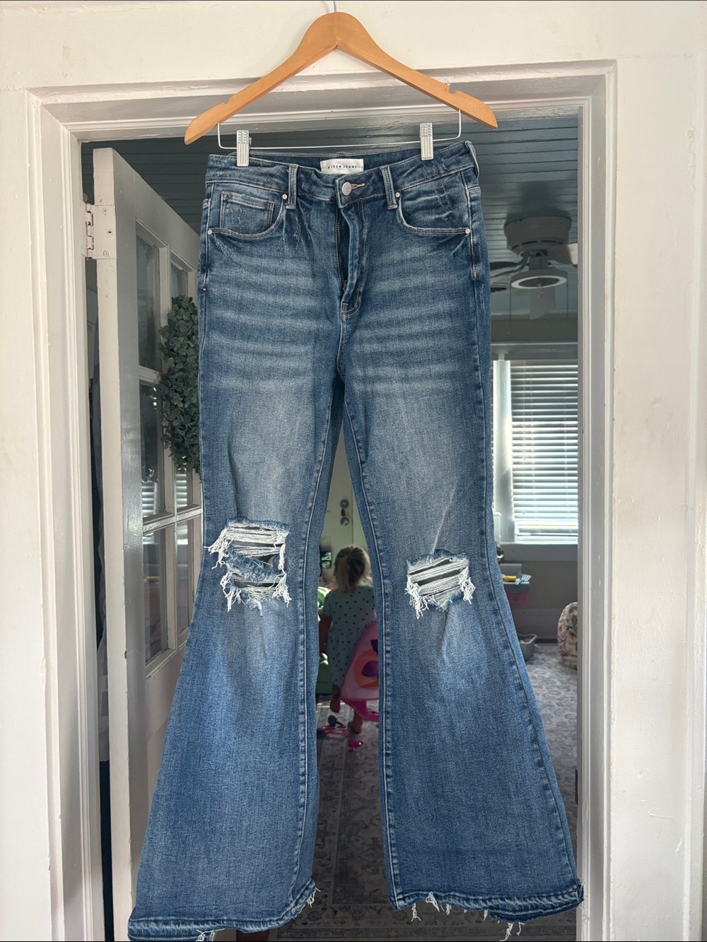 Distressed Medium Blue Flare Jeans with Knee Rips